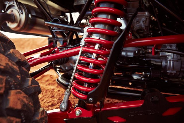 The Talon 1000R model comes standard with Fox Podium 2.5 shocks and 17.7 inches of front-wheel travel and 20.1 inches of rear-wheel travel. The X model has different suspension and comes with Fox Podium 2.0 shocks. Both perform well for their intended terrain.