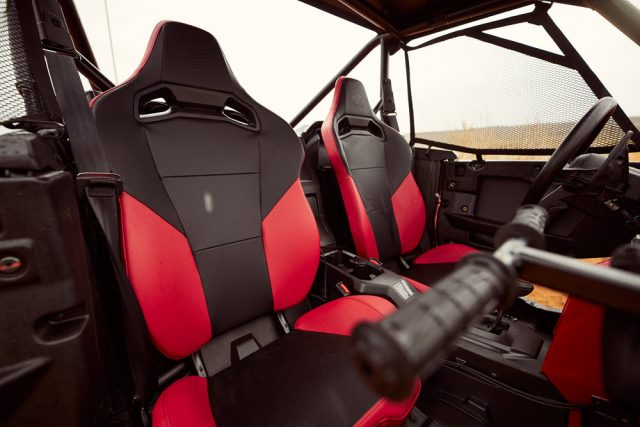The stock Honda Talon seats are pretty good. They come ready to add a four-point harness but come standard with a three-point harness. The passenger grab handle is nice and is easy to adjust.